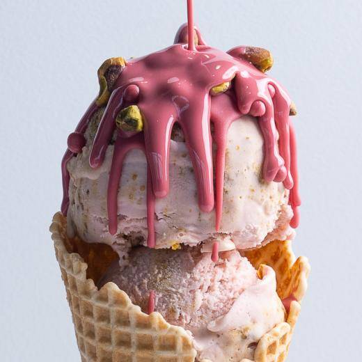 pink ice cream cone on gray background