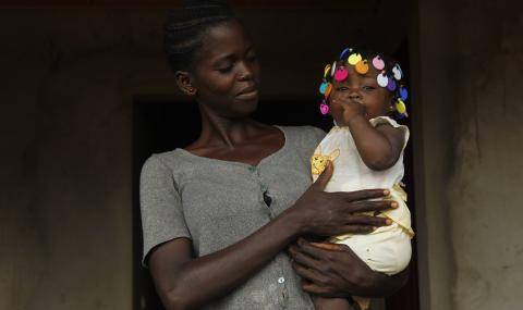 Cocoa farmer community - mother with child