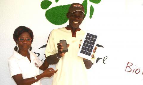 Zallé Alimissi Salame proud of his new mobile phone and solar charger.