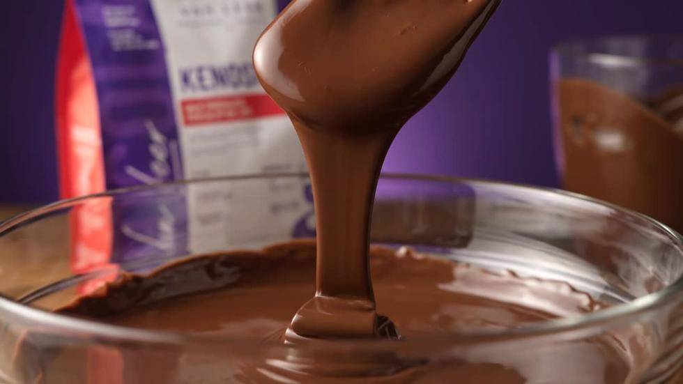 Melted chocolate drizzling into a bowl