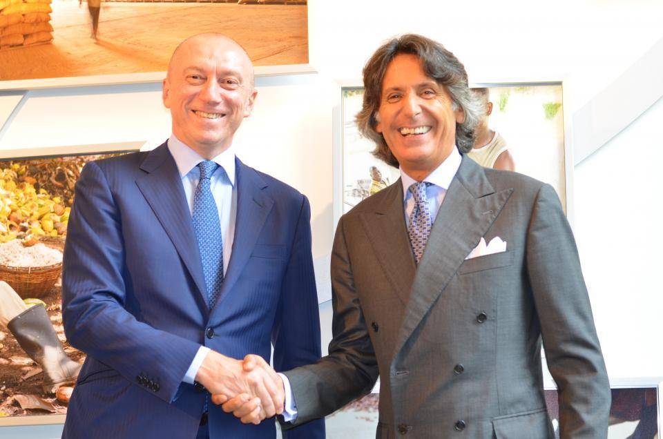 Massimo Garavaglia and Valerio D'Orsogna shake hands on the agreement.