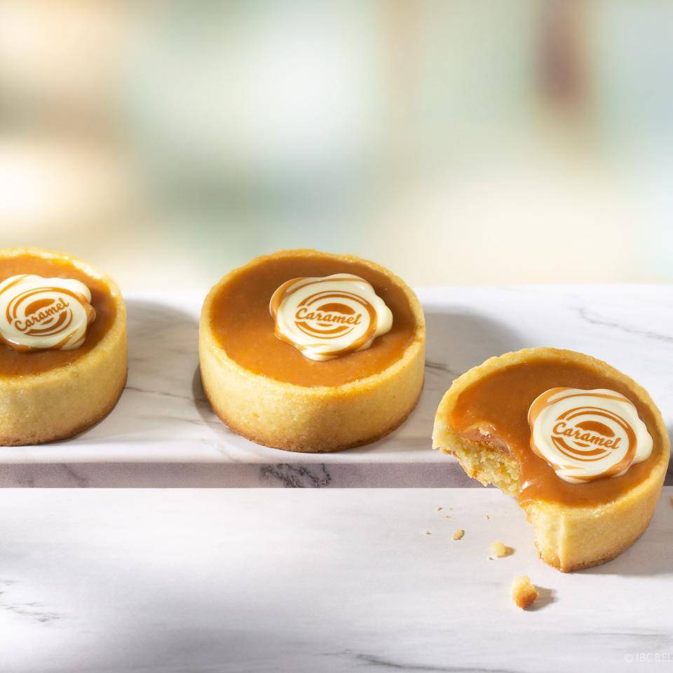 Caramel tarts with chocolate decoration seal with "Caramel" print