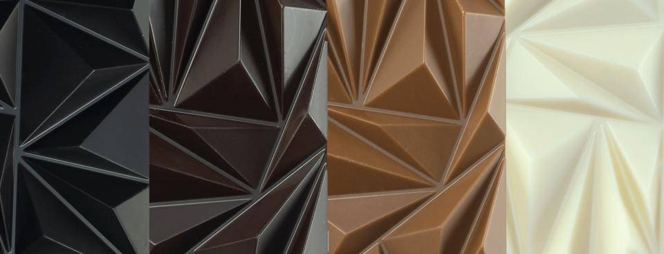 chocolate bars - dark, milk, and white - all lined up in a row