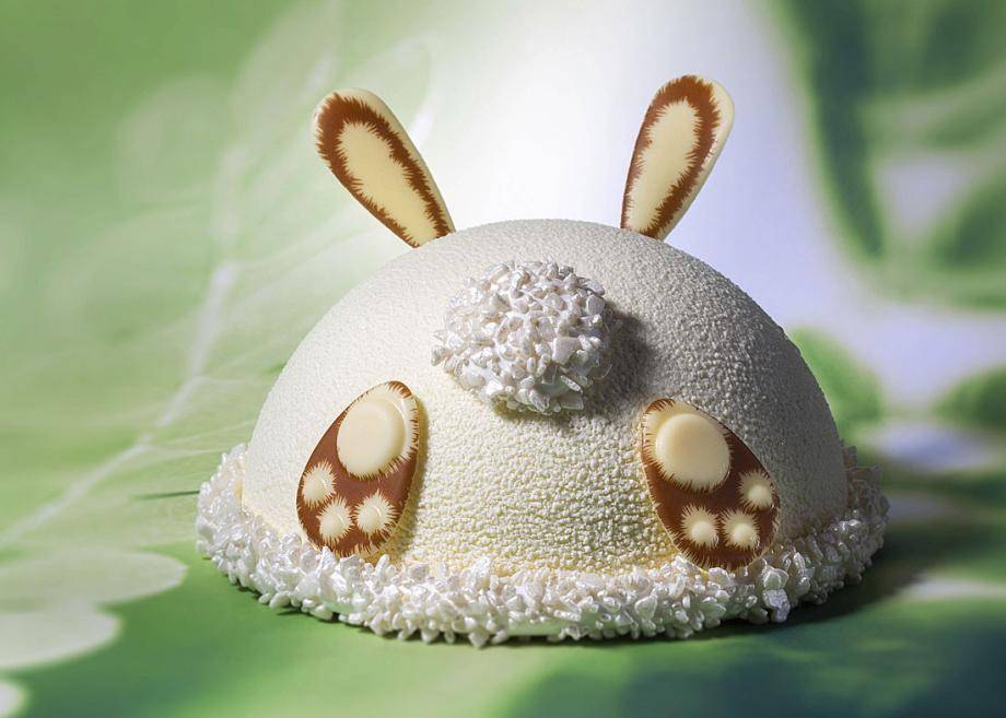 Easter bunny bombe with sprinkles and chocolate decorations of bunny ears and bunny feet