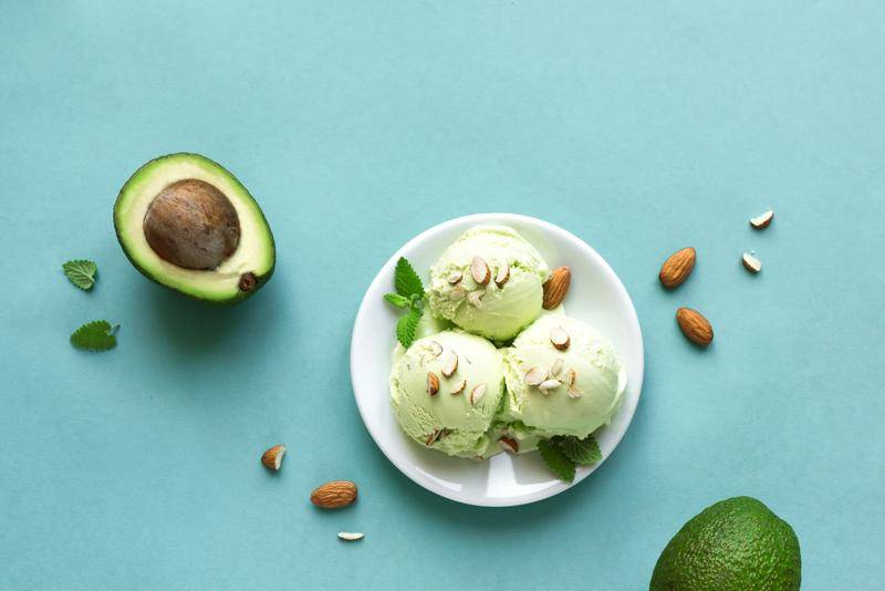 bowl of green ice cream on a blue background